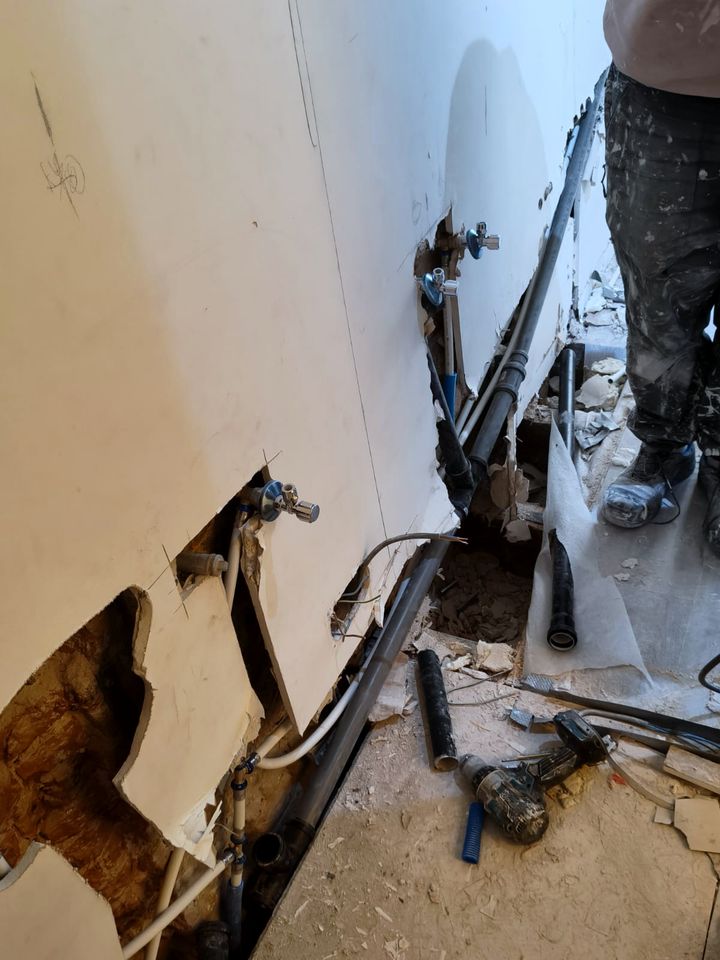 Old pipes exposed during strip-out